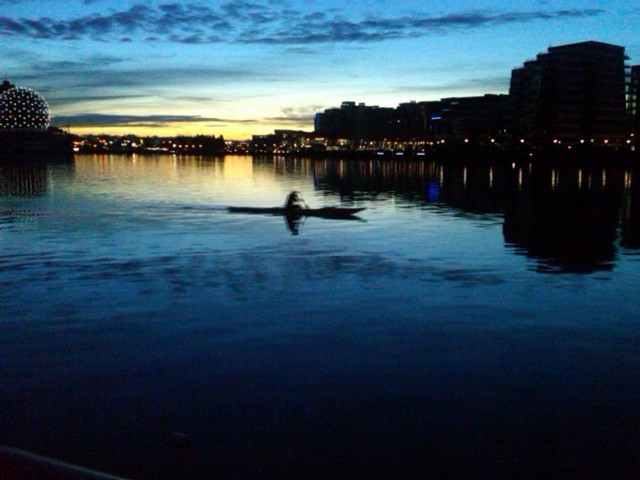 Boater at dawn on False Creek 