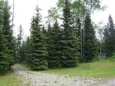 Water Valley Alberta Real Estate -  Land for sale: 1.7 Acres, Treed, Building Site, 15 GPM Well, Gravel Driveway, Creek, Shed    (Listed 2011-06-22)